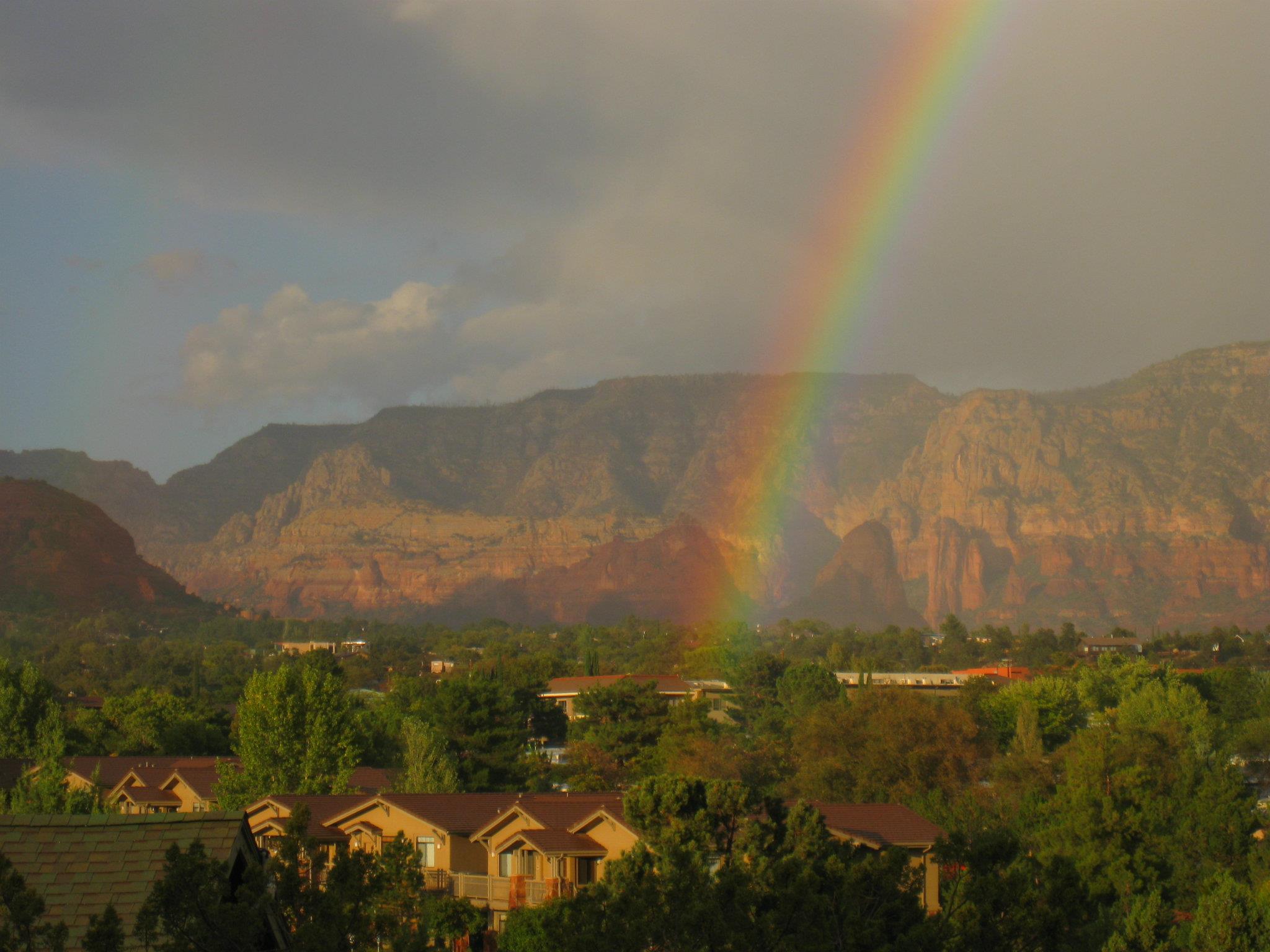 Rainbow over the Sedona red rocks — view from Red Rock Suites