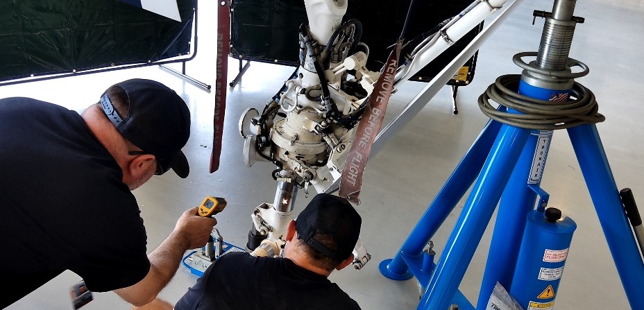 Jamie monitoring heat build-up on landing gear during FP-300 laser cleaning — Netflix Aviation